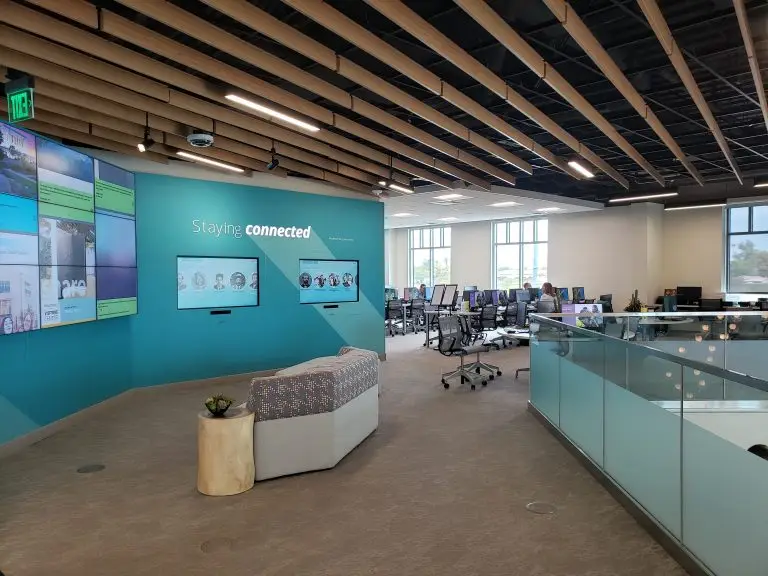 The Mesa FamilySearch Center, where events such as FamilySearch classes and trainings occur. People working on computers in the background are visible in the FamilySearch Center.