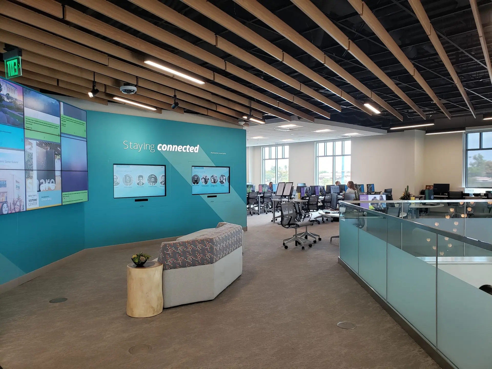 The Mesa FamilySearch Center, where events such as FamilySearch classes and trainings occur. People working on computers in the background are visible in the FamilySearch Center.